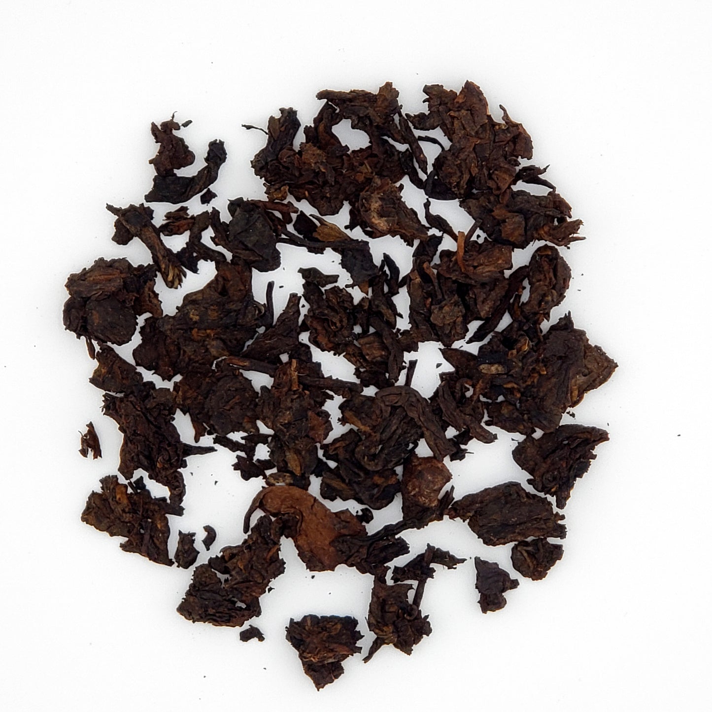 Close up of pu-erh tea leaves broken from the cake