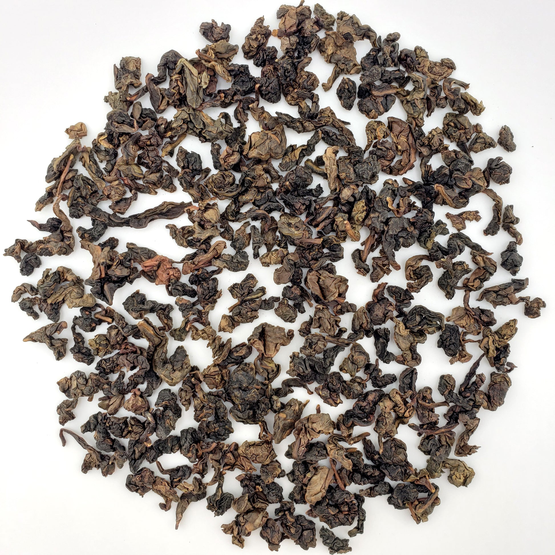 Loose tea leaves on a white background